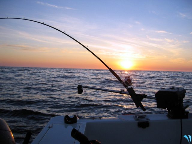 a beautiful sunset and a fishing boat